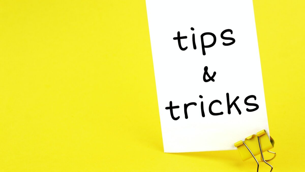 tips & tricks. Note written on a white sticker with paper clip.