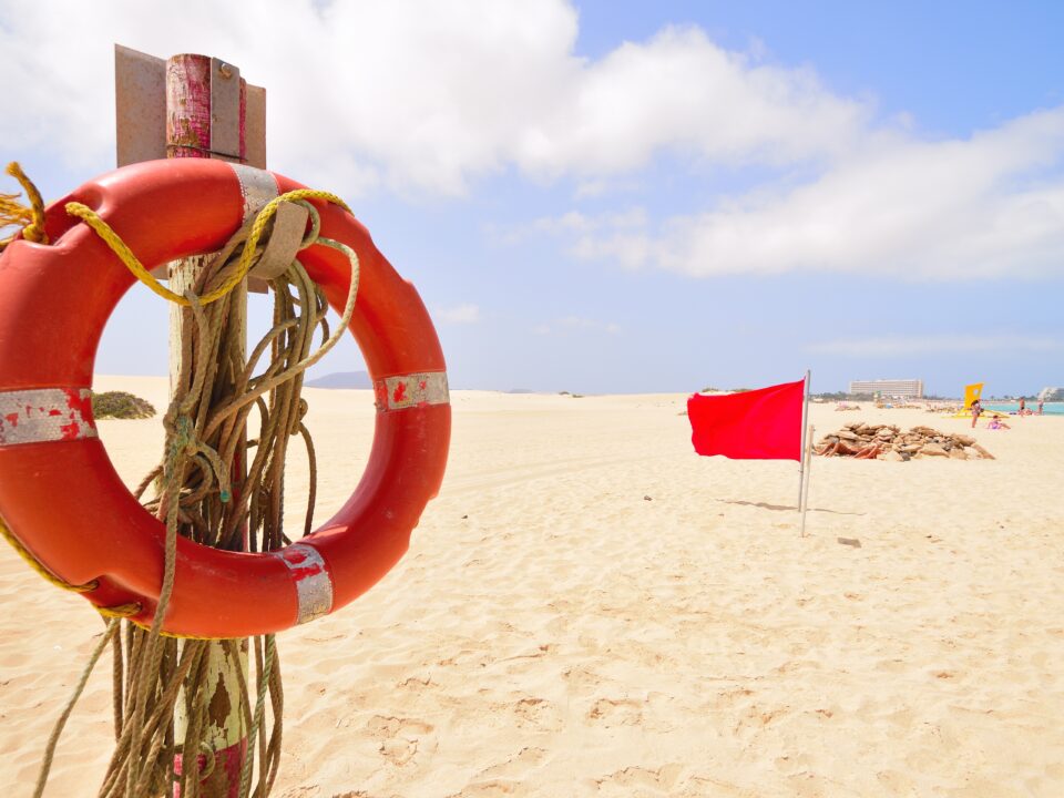 Life buoy at the beach for safety red flag summer