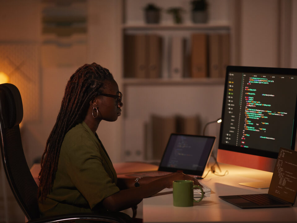 African-American Woman Writing Computer Code