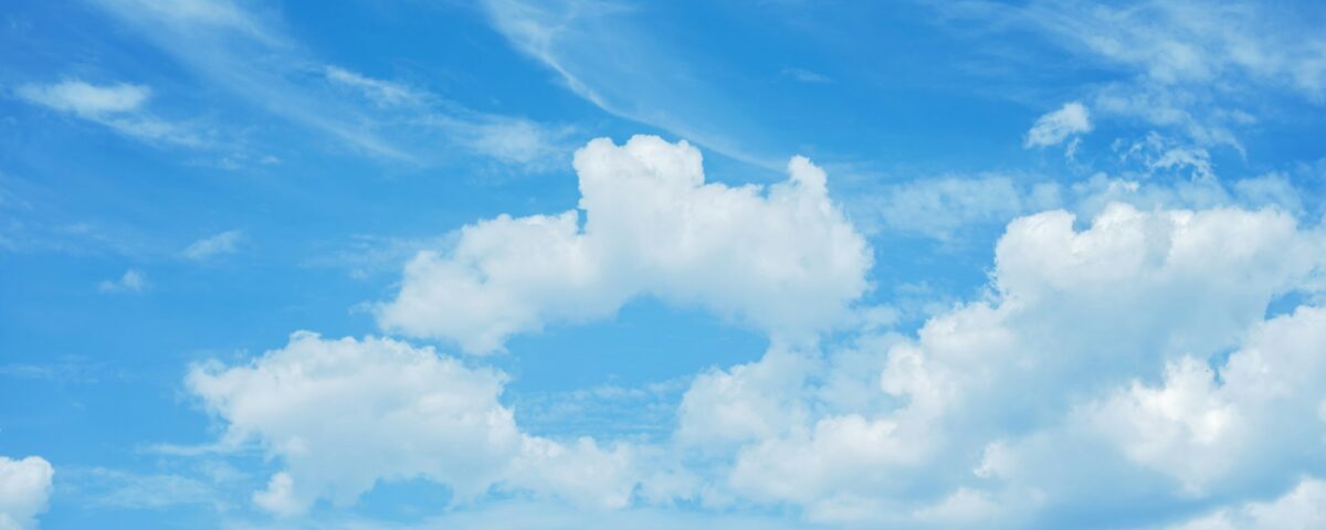 Blue sky background with clouds. white fluffy clouds