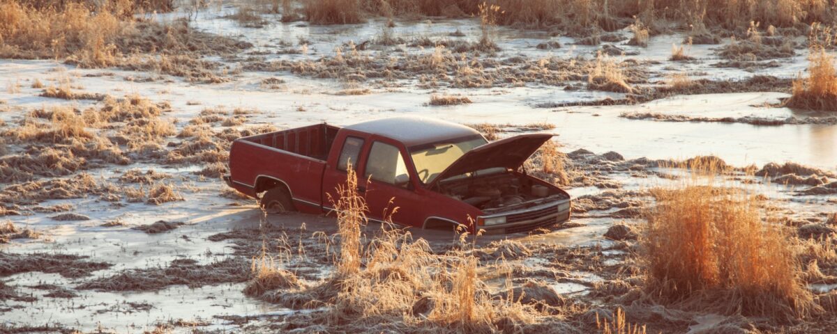 Pick up truck stuck in swamp